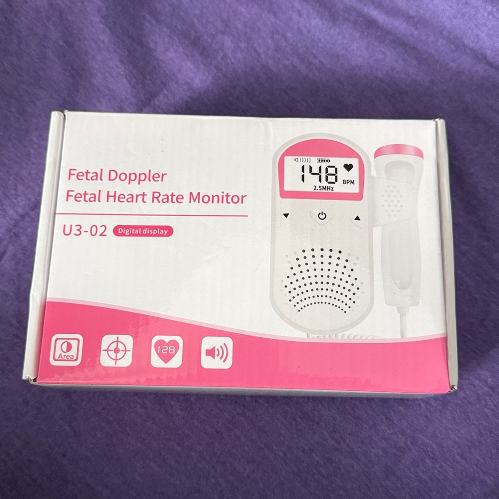 Pink and White Portable Doppler Device